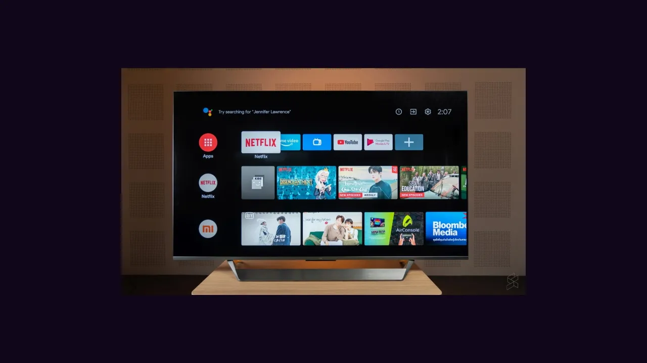 A smart television showing an app home screen in a living room