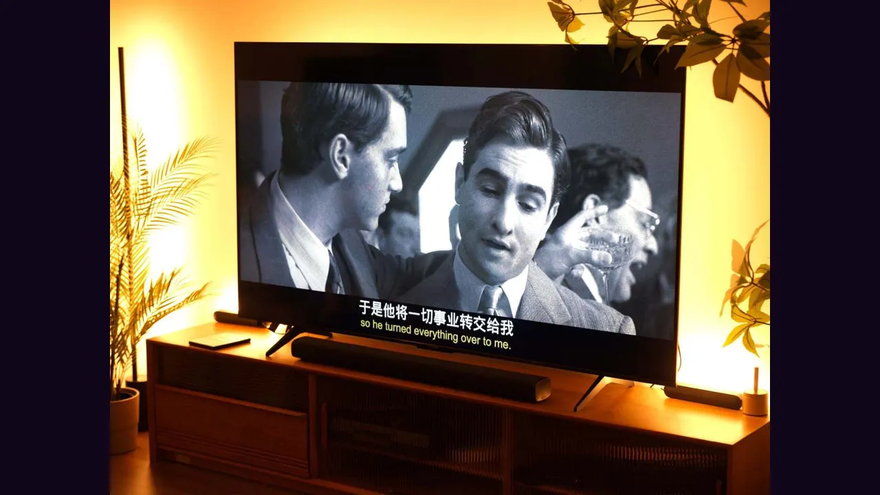 A television playing a film with subtitles on screen
